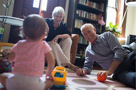 Toddler girl playing with grandparents Stock Photo - Premium Royalty-Free, Code: 614-07145891