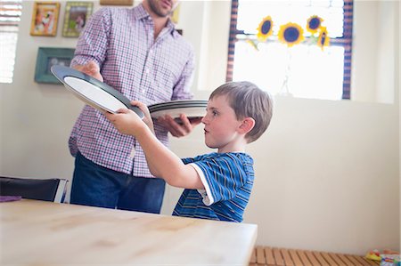 child setting the table