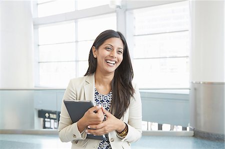 Businesswoman holding digital tablet Stock Photo - Premium Royalty-Free, Code: 614-07146045