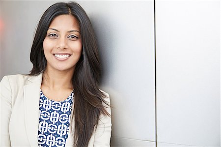 portrait of a woman smiling indian - Portrait of young woman Stock Photo - Premium Royalty-Free, Code: 614-07146047