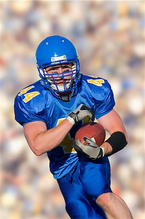 football (american ball) - American footballer running with ball Foto de stock - Sin royalties Premium, Código: 614-07146104