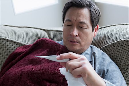 sick home - Mature man taking temperature Stock Photo - Premium Royalty-Free, Code: 614-07146221