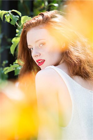 red hair woman rear view - Portrait of young woman with red hair Stock Photo - Premium Royalty-Free, Code: 614-07146413