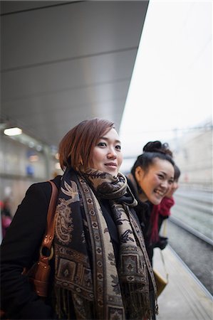 rail station - Young women waiting for train Stock Photo - Premium Royalty-Free, Code: 614-07146521