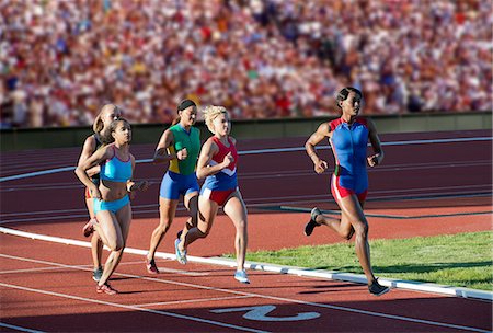 running woman race - Runners racing on track Stock Photo - Premium Royalty-Free, Code: 614-07194374
