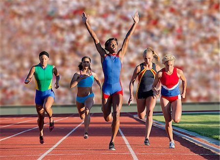 Runners at finish line Stock Photo - Premium Royalty-Free, Code: 614-07194378