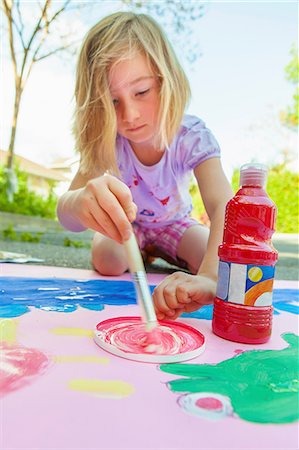 Girl painting with tempera on paper Stock Photo - Premium Royalty-Free, Code: 614-07194371