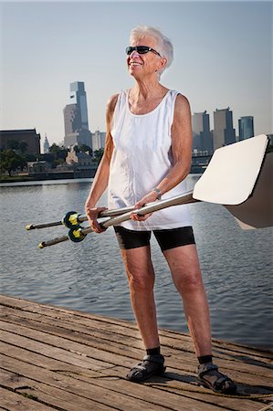 senior exercising - Rower on pier holding oars Stock Photo - Premium Royalty-Free, Code: 614-07194432