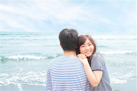 Young woman leaning on boyfriend's shoulder Stock Photo - Premium Royalty-Free, Code: 614-07194481