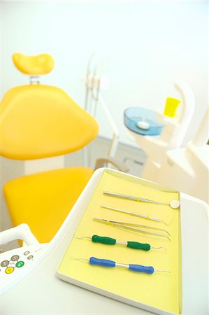 Dental chair and surgical tray in clinic Stock Photo - Premium Royalty-Free, Code: 614-07194619