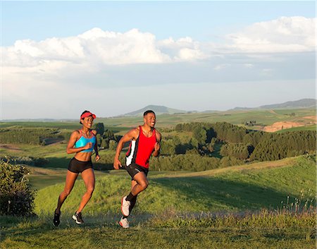 Young couple jogging in landscape, Othello, Washington, USA Stock Photo - Premium Royalty-Free, Code: 614-07194642