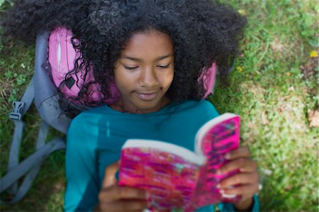 simsearch:649-07736779,k - Close up of girl reading in park Stock Photo - Premium Royalty-Free, Code: 614-07194735