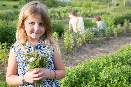 simsearch:649-07239024,k - Portrait of girl holding bunch of foliage on herb farm Stock Photo - Premium Royalty-Free, Code: 614-07194754