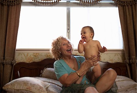 senior female cute - Grandmother holding baby granddaughter Stock Photo - Premium Royalty-Free, Code: 614-07194781