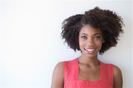 Portrait of young woman against white background Photographie de stock - Premium Libres de Droits, Code: 614-07194825