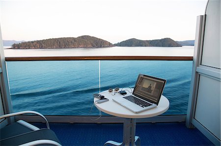 environmental issues for computers - View from cruise ship with laptop on table, Alaska, USA Stock Photo - Premium Royalty-Free, Code: 614-07194884