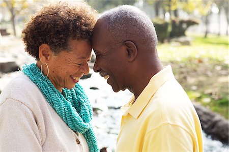 senior citizen african american - Senior couple face to face, smiling Stock Photo - Premium Royalty-Free, Code: 614-07234927