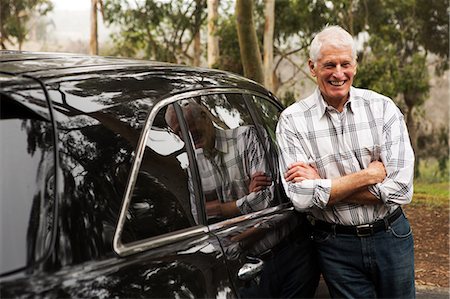 simsearch:614-07234961,k - Senior man standing against black vehicle Stock Photo - Premium Royalty-Free, Code: 614-07234954