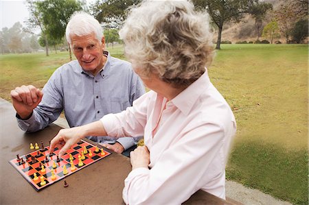 simsearch:614-07234961,k - Husband and wife playing chess in the park Stock Photo - Premium Royalty-Free, Code: 614-07234955