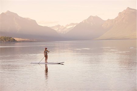 Woman on canoe, Lake McDonald, Glacier National Park, Montana, USA Stock Photo - Premium Royalty-Free, Code: 614-07239919