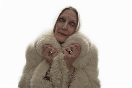 fur coats for women image - Studio shot of mature woman with eyes closed Stock Photo - Premium Royalty-Free, Code: 614-07240053