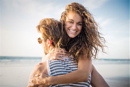 fun, outdoors - Young couple hugging in San Diego beach Stock Photo - Premium Royalty-Free, Code: 614-07240074