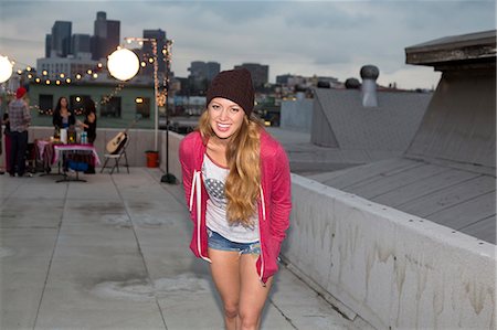 party summer usa not business not winter not autumn not indoors not office not family - Young woman in wool hat at rooftop barbecue Stock Photo - Premium Royalty-Free, Code: 614-07240197