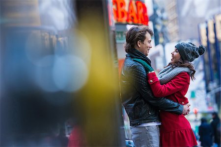 street color buildings - Young tourist couple hugging, New York City, USA Stock Photo - Premium Royalty-Free, Code: 614-07444078