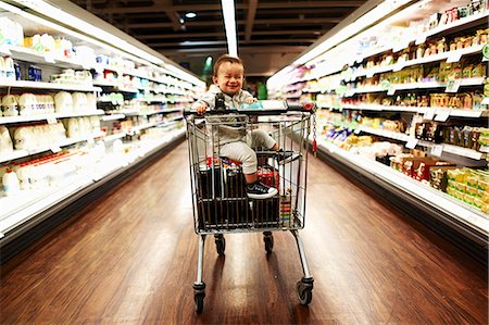 simsearch:614-06813280,k - Baby boy sitting in supermarket trolley Stock Photo - Premium Royalty-Free, Code: 614-07444279