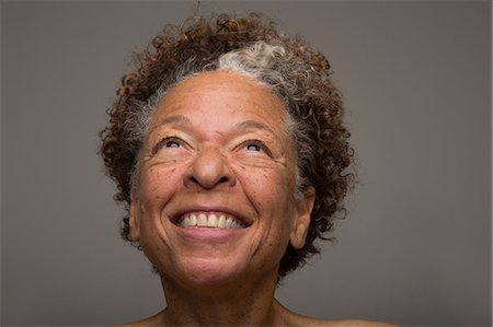 senior woman fun - Close up studio portrait of smiling senior woman Stock Photo - Premium Royalty-Free, Code: 614-07444327