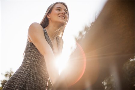 simsearch:614-08202342,k - Teenage girl leaning on railings in park Stock Photo - Premium Royalty-Free, Code: 614-07444332