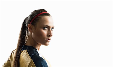 Studio portrait of young female soccer player Photographie de stock - Premium Libres de Droits, Code: 614-07444391