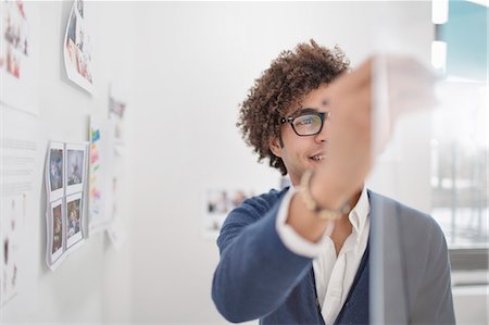 sticky notes - Young man with adhesive notes Stock Photo - Premium Royalty-Free, Code: 614-07487066