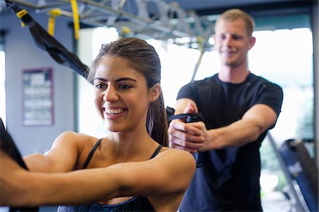 fitness couple workout - Couple working out in gym Stock Photo - Premium Royalty-Free, Code: 614-07487100