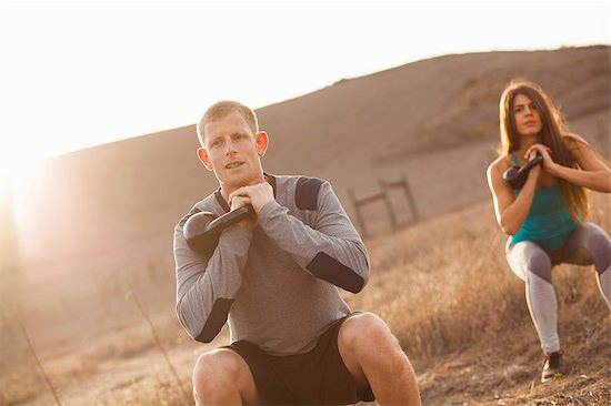 Couple working out with weights Foto de stock - Sin royalties Premium, Código de la imagen: 614-07487130