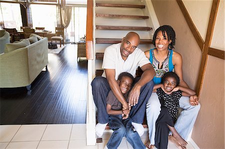 Portrait of mature couple with son and daughter on stairs Stock Photo - Premium Royalty-Free, Code: 614-07487237