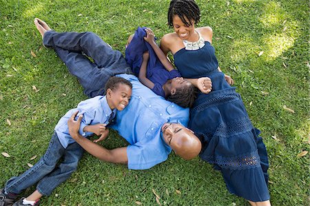 family overhead - Mature couple with son and daughter relaxing in park Stock Photo - Premium Royalty-Free, Code: 614-07487233