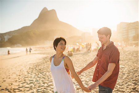 rio de janeiro - Young couple enjoying sunset, Ipanema Beach, Rio, Brazil Stock Photo - Premium Royalty-Free, Code: 614-07652205