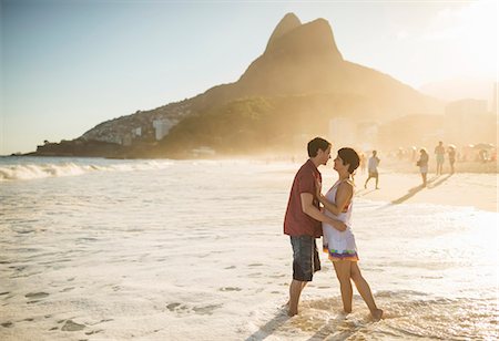 embrace joyful full length caucasian - Young couple hugging at sunset, Ipanema Beach, Rio, Brazil Stock Photo - Premium Royalty-Free, Code: 614-07652206