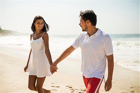 friendship travel adult - Couple strolling on Arpoador beach, Rio De Janeiro, Brazil Stock Photo - Premium Royalty-Free, Code: 614-07652229