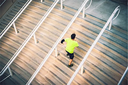 Mature male runner training on steps Stock Photo - Premium Royalty-Free, Code: 614-07652363