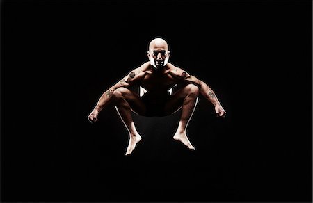 fitness man portrait not woman not group - Mature man jumping mid air Stock Photo - Premium Royalty-Free, Code: 614-07652415