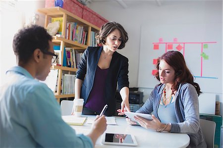 small - Young woman leading small meeting Stock Photo - Premium Royalty-Free, Code: 614-07708204