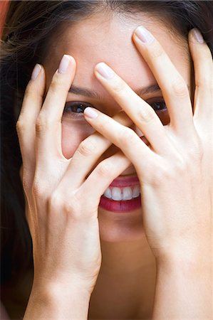 simsearch:614-07486964,k - Portrait of young woman with hands covering face Stock Photo - Premium Royalty-Free, Code: 614-07735127
