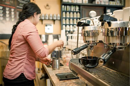 serving coffee - Barista busy with espresso machine in cafe Stock Photo - Premium Royalty-Free, Code: 614-07735168