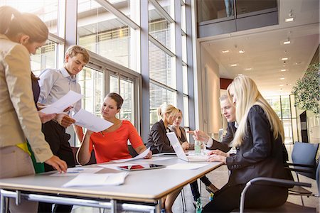 Businessmen and businesswomen at brainstorming meeting Stock Photo - Premium Royalty-Free, Code: 614-07735329