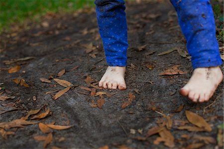 shoeless - Muddy feet of four year old girl standing in garden soil Stock Photo - Premium Royalty-Free, Code: 614-07735501