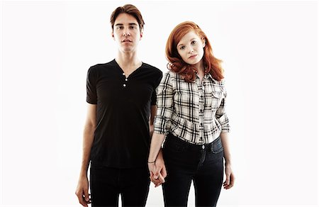 redhead man portrait - Studio portrait of bored looking young couple Stock Photo - Premium Royalty-Free, Code: 614-07735547