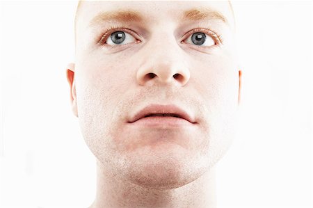 portrait - Close up studio portrait of young man Stock Photo - Premium Royalty-Free, Code: 614-07735579
