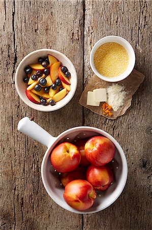 food bowl top view - Fresh blueberries and nectarines with dry polenta, butter, orange zest and organic flour Stock Photo - Premium Royalty-Free, Code: 614-07735615